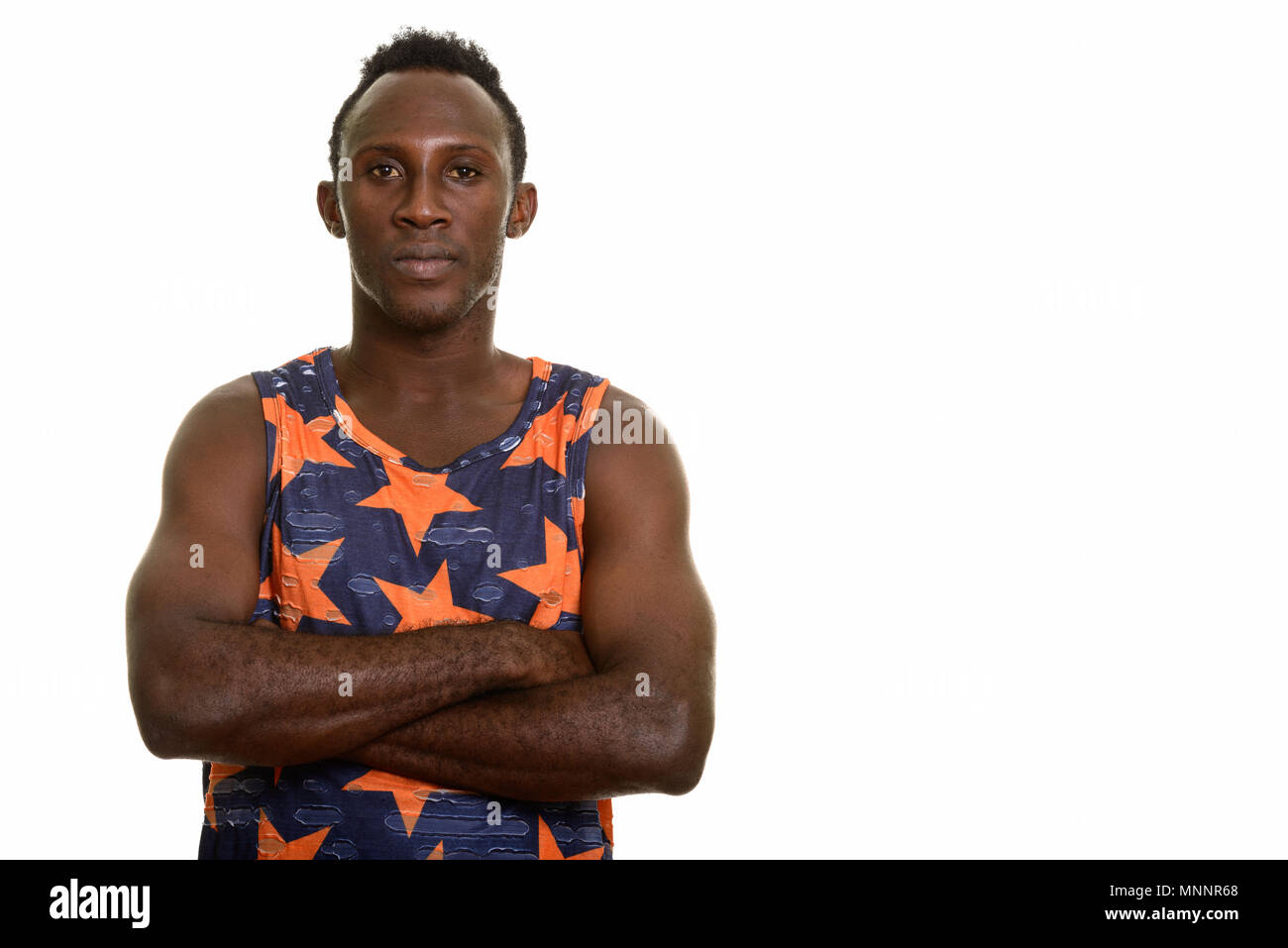 Young black African man with arms crossed Stock Photo