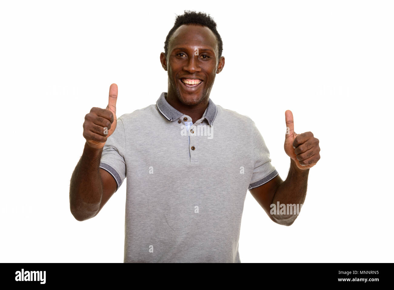 Young happy black African man giving thumbs up  Stock Photo