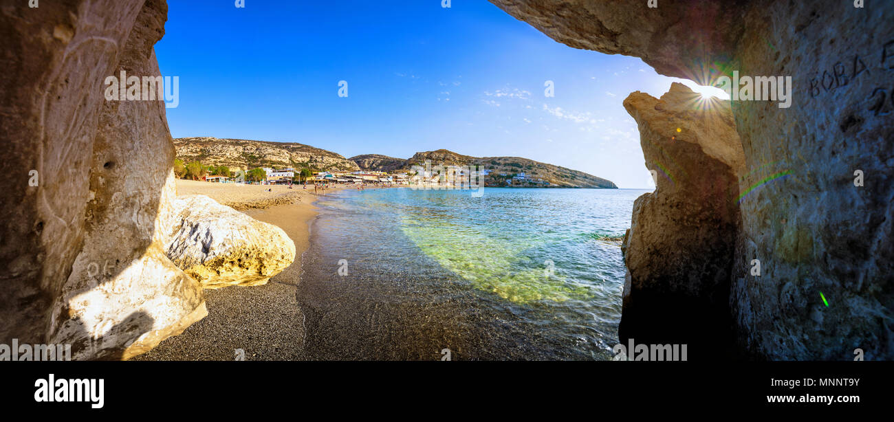 Matala with caves on the rocks that were used as a roman cemetery and at the decade of 70's were living hippies from all over the world, Crete, Greece Stock Photo
