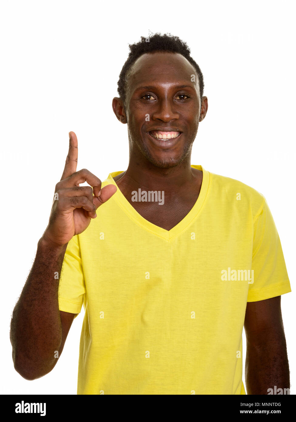 Young happy African man smiling and pointing finger up Stock Photo - Alamy