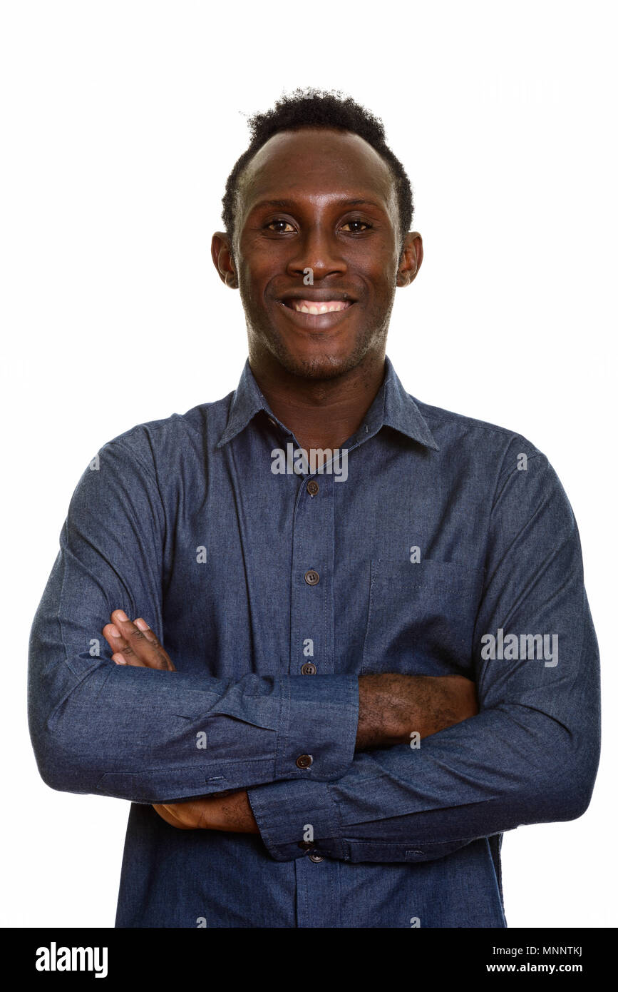Young happy black African man smiling with arms crossed Stock Photo - Alamy