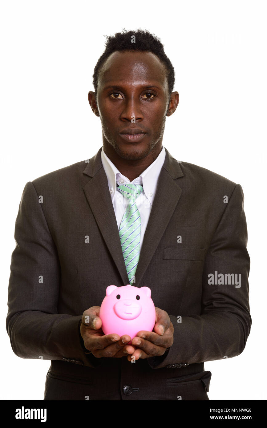 Young black African businessman holding piggy bank Stock Photo Alamy