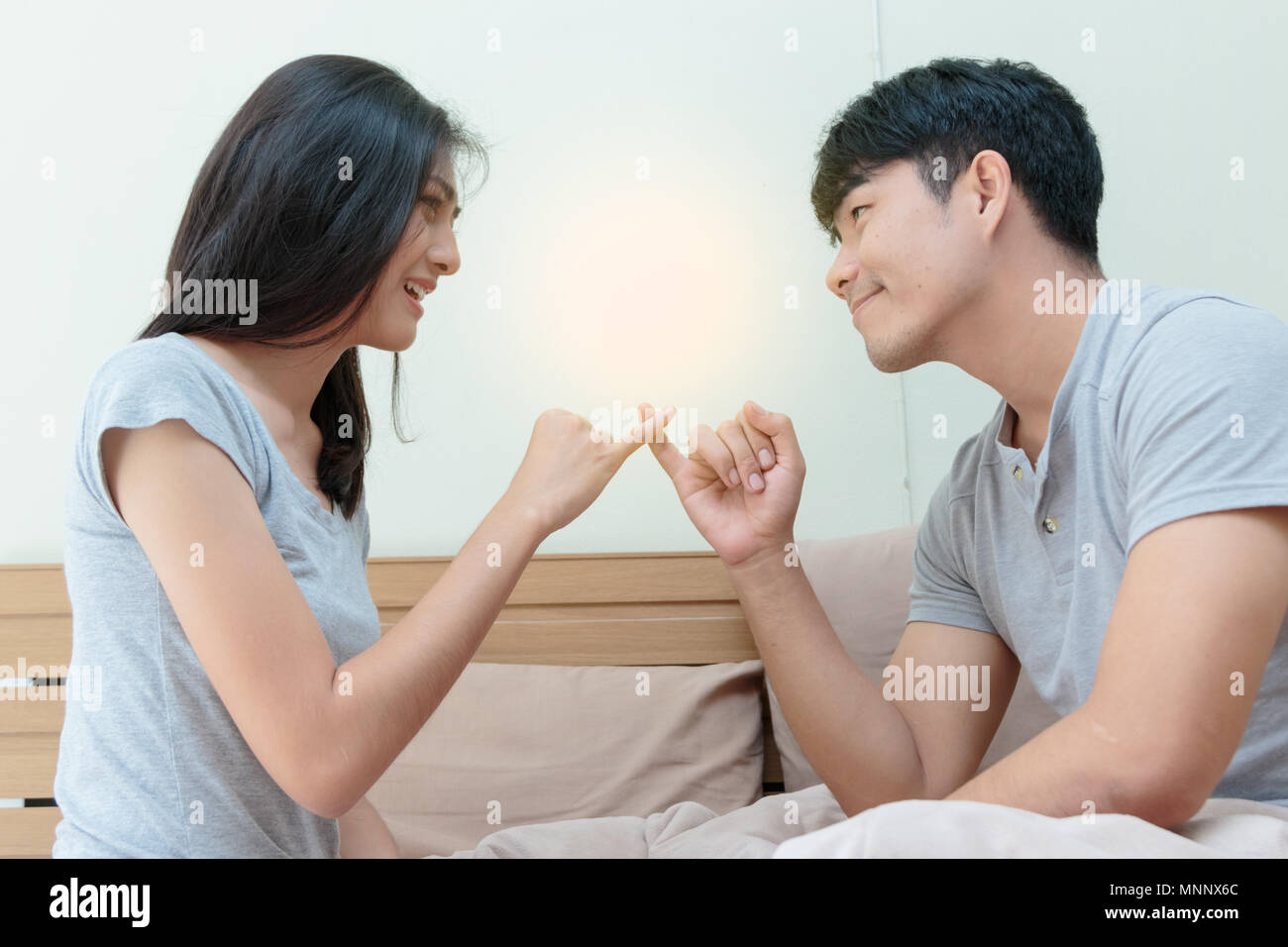 Couple relationship concepts, asian man trying to reconcile with his girlfriend after have an argument. Stock Photo