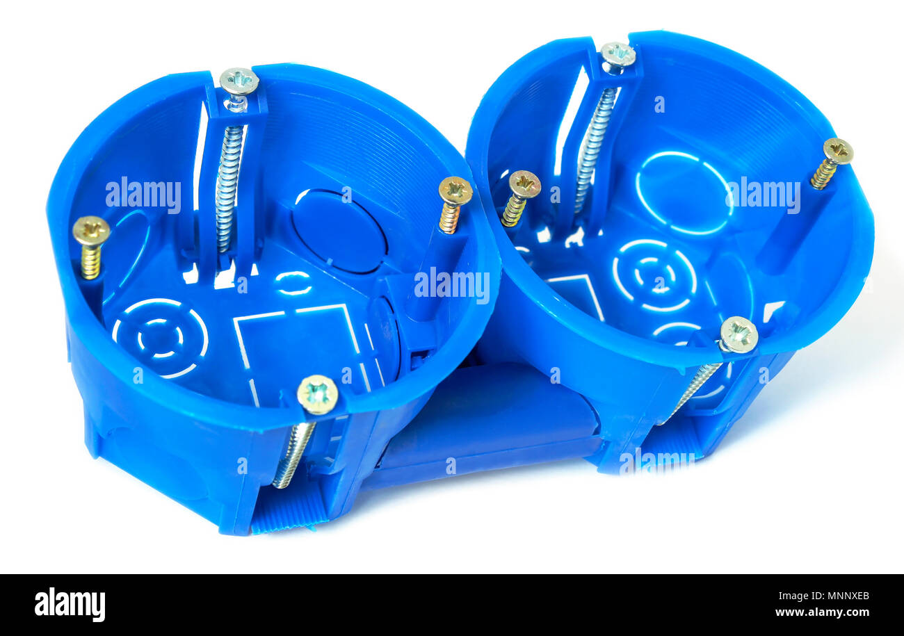 Plastic enclosures for installation of electrical household appliances in concrete and gypsum wall. Stock Photo