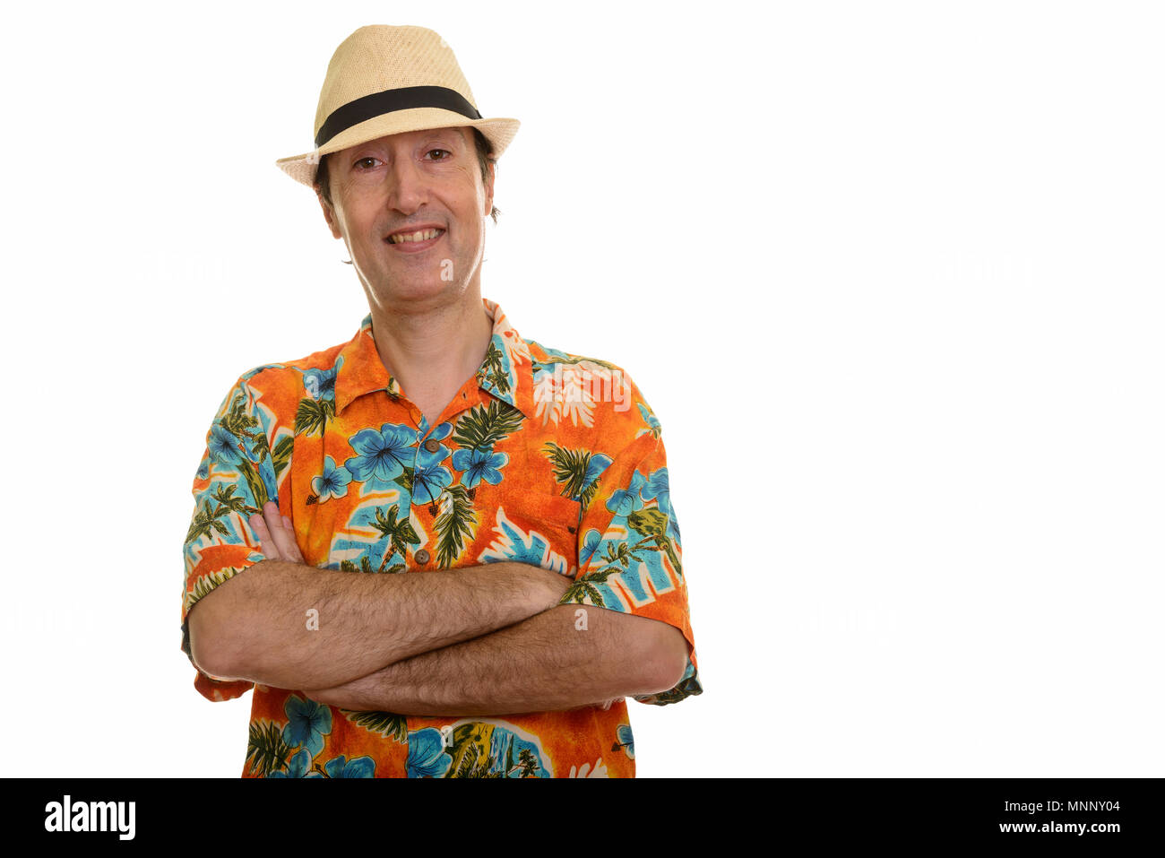 Studio shot of happy mature man smiling with arms crossed Stock Photo ...