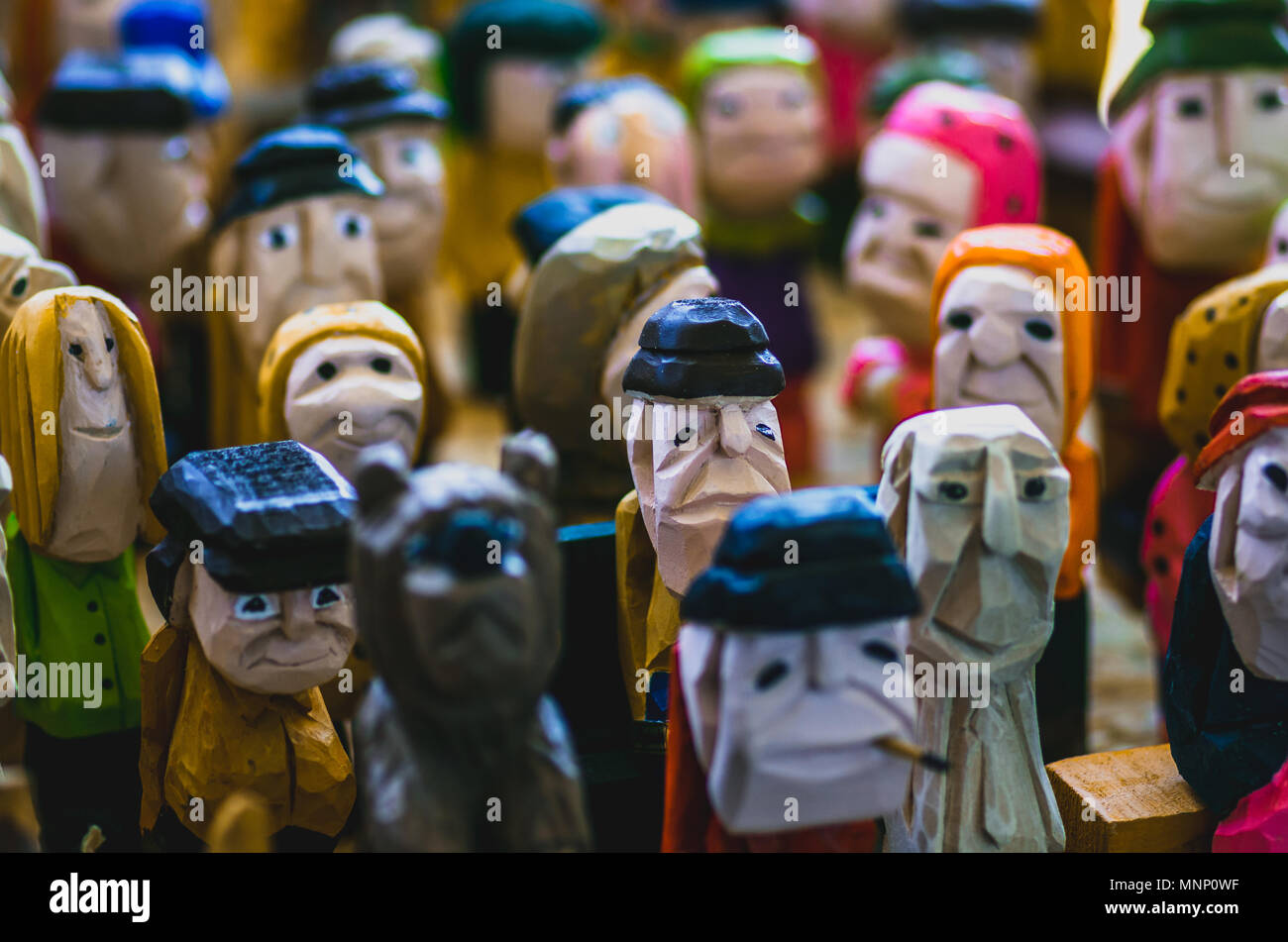 Colorful crowd of wooden carved figurines Stock Photo Alamy