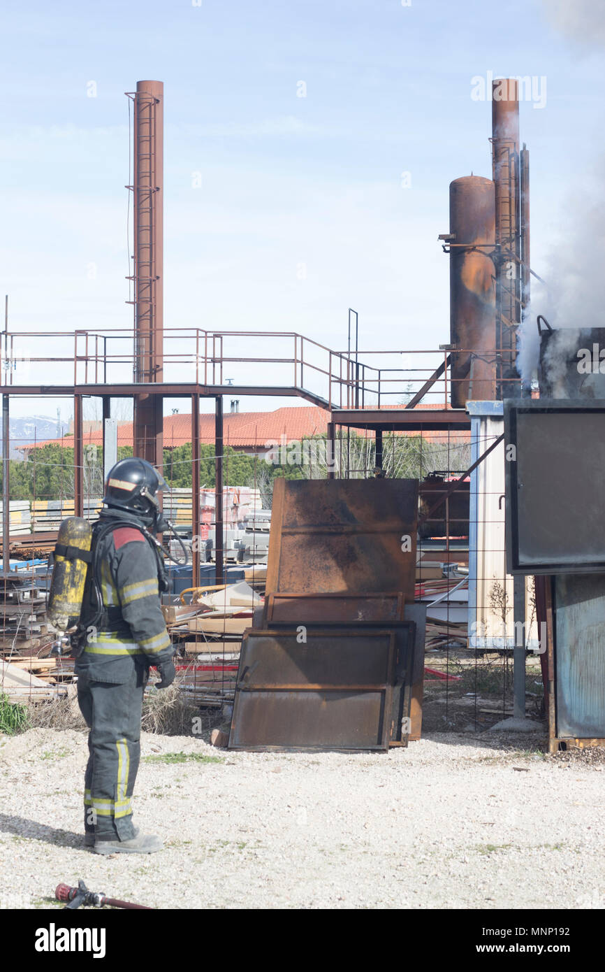 Firefighter putting out fire training station extinguisher backdraft ...