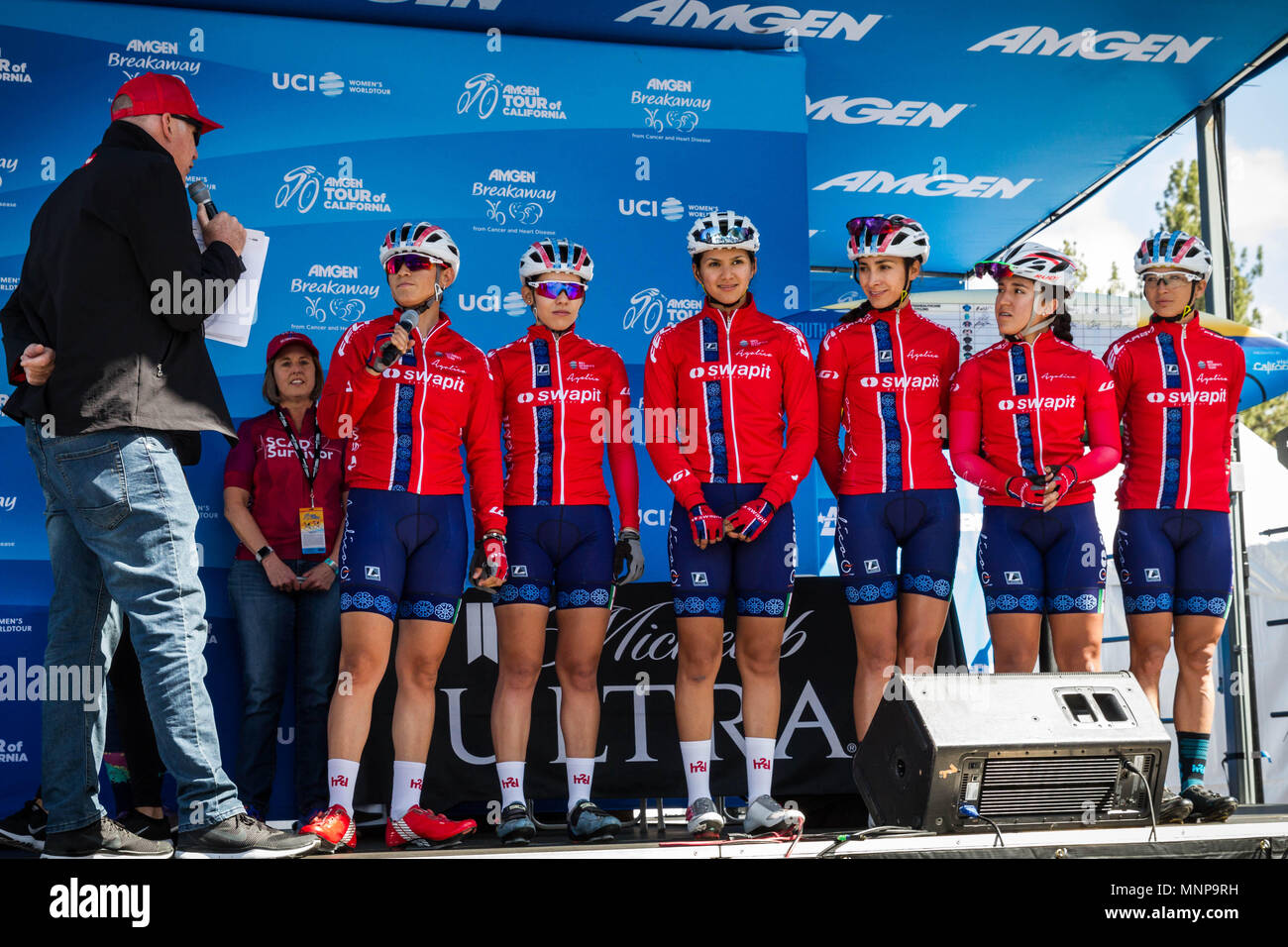 South Lake Tahoe, California, USA. 18th May, 2018. Friday, May 18, 2018.Emcee DAVE TOWLE introduces Swapit | Agolico Cycling Pro Team (MEX) before the start of Stage 2 of the Amgen Tour of California Women's Race empowered with SRAM, which starts and finishes near Heavenly Ski Resort in South Lake Tahoe, California.BIB, NAME, NAT.121, RAMÃªREZ FREGOSO, MEX.122, MU''žOZ GRANDON, CHI.123, PRIETO CASTA''žEDA, MEX.124, SALAZAR VAZQUEZ, MEX.125, SANTOYO PEREZ, MEX.126, VARGAS BARRIENTOS, CRC Credit: Tracy Barbutes/ZUMA Wire/Alamy Live News Stock Photo