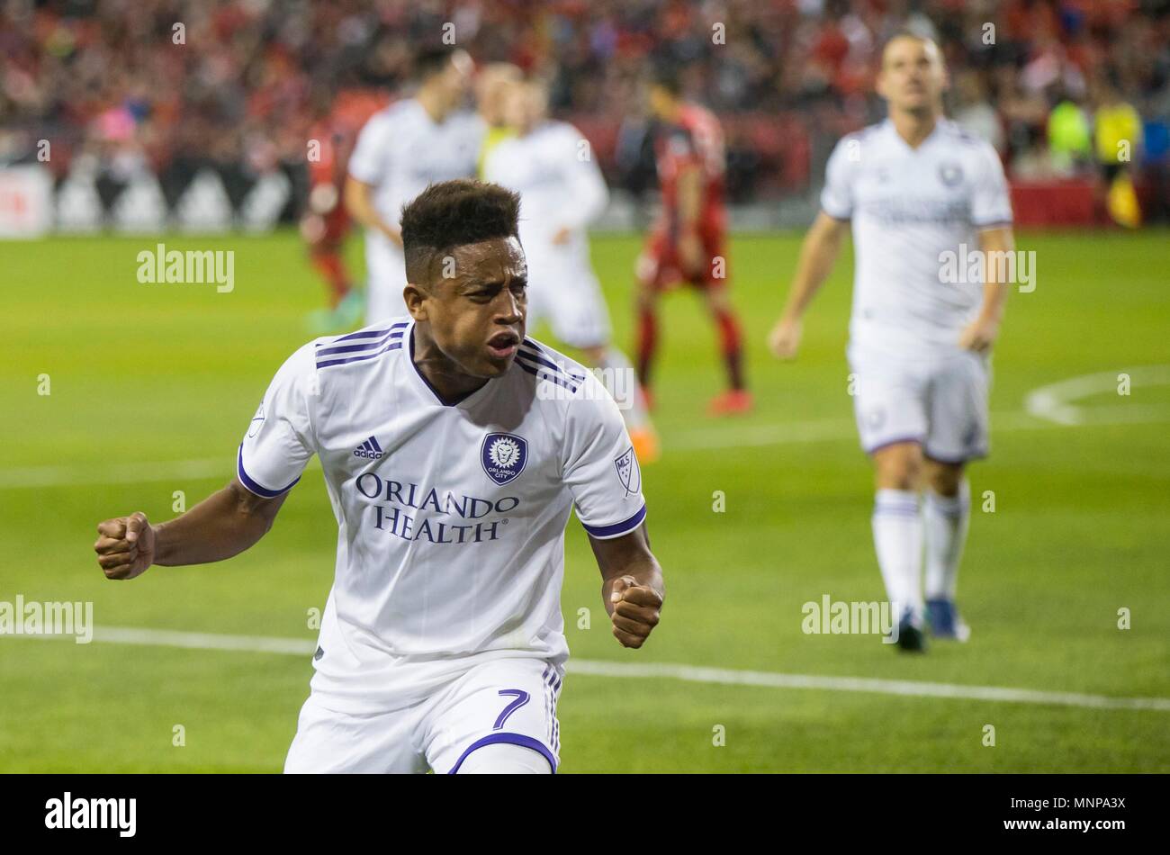 (180519) -- TORONTO, May 19, 2018 (Xinhua) -- Cristian Higuita (Front) of Orlando City SC celebrates scoring during the 2018 Major League Soccer (MLS) match between Toronto FC and Orlando City SC at BMO Field in Toronto, Canada, May 18, 2018. Toronto FC won 2-1. (Xinhua/Zou Zheng) Stock Photo