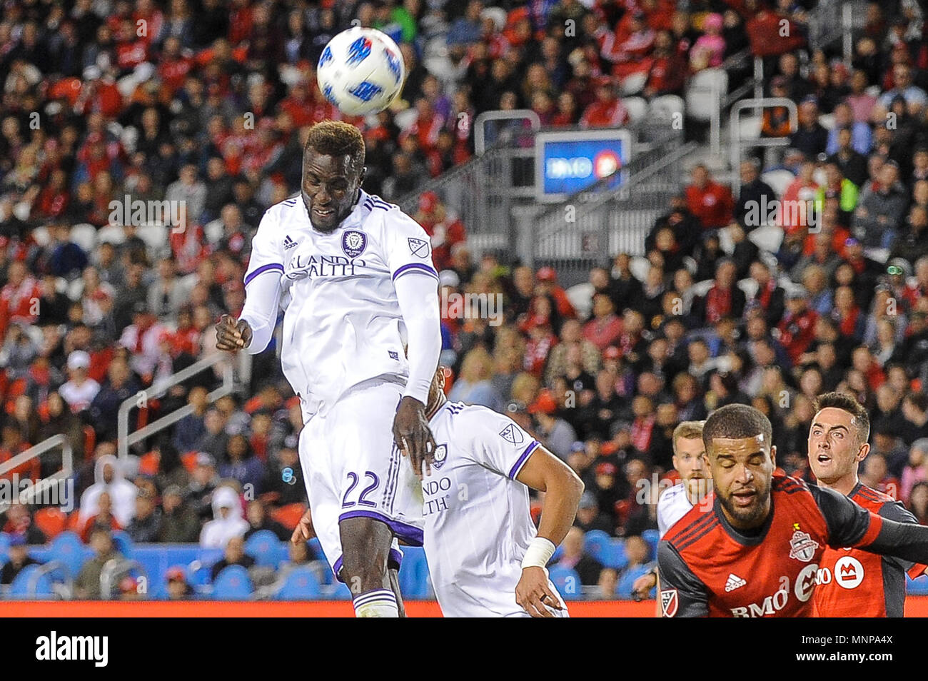 Lamine Sané (22) seen kicking the ball by head during 2018 MLS Regular Season match between Toronto FC (Canada) and  Orlando City SC (USA) at BMO Field (Score 2:1) Stock Photo