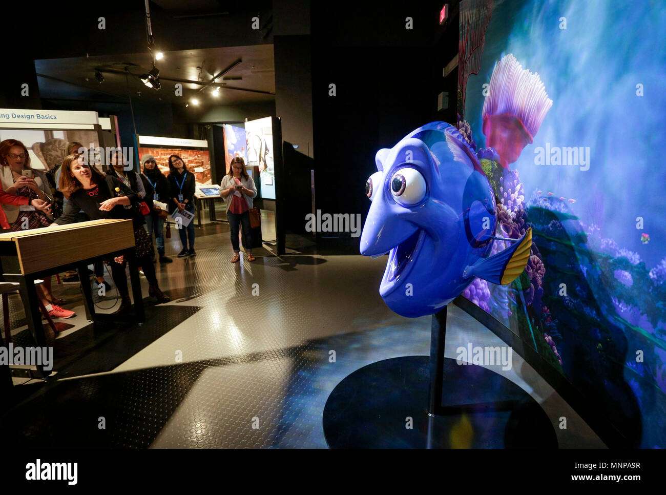 Vancouver, Canada. 18th May, 2018. Visitors watch an interactive display to learn about using lighting effect during their visit to the Vancouver, Canada. 18th May, 2018. Visitors watch an interactive display to learn about using lighting effect during their visit to the