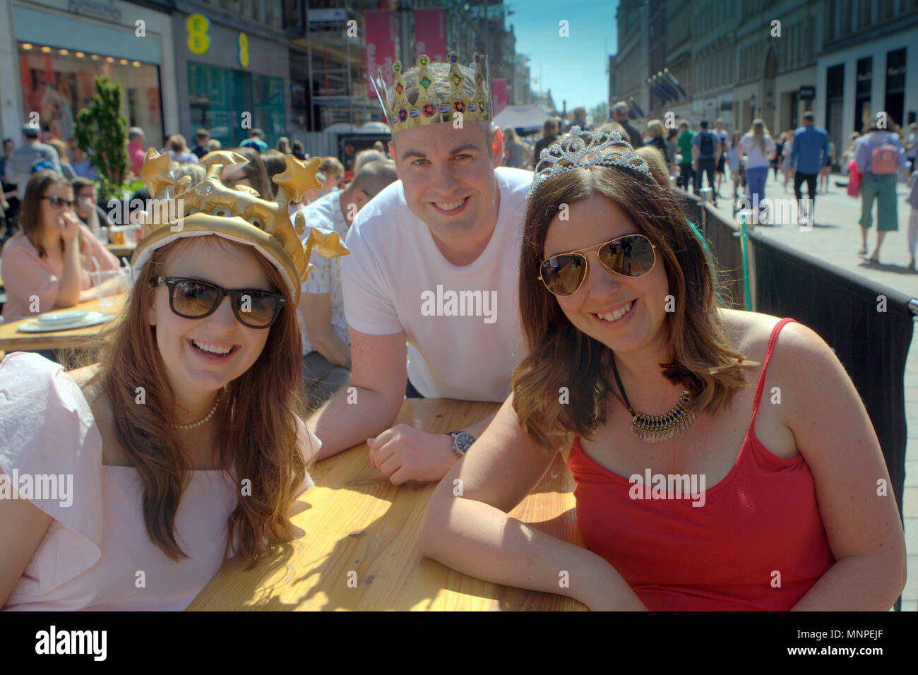 Glasgow, Scotland, UK 19th May.UK Weather: Sunny weather over the city brought the locals and tourists into the streets for taps aff weather.  As the royal wedding was highlighted by early revelers in Buchanan street the style mile fashion centre of Scotland. Gerard Ferry/Alamy news Stock Photo