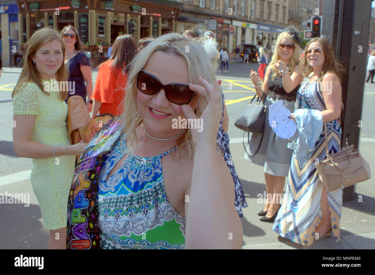 Glasgow, Scotland, UK 19th May.UK Weather: Sunny weather over the city brought the locals and tourists into the streets for taps aff weather.  As the royal wedding was highlighted by early revelers in Buchanan street the style mile fashion centre of Scotland. Gerard Ferry/Alamy news Stock Photo