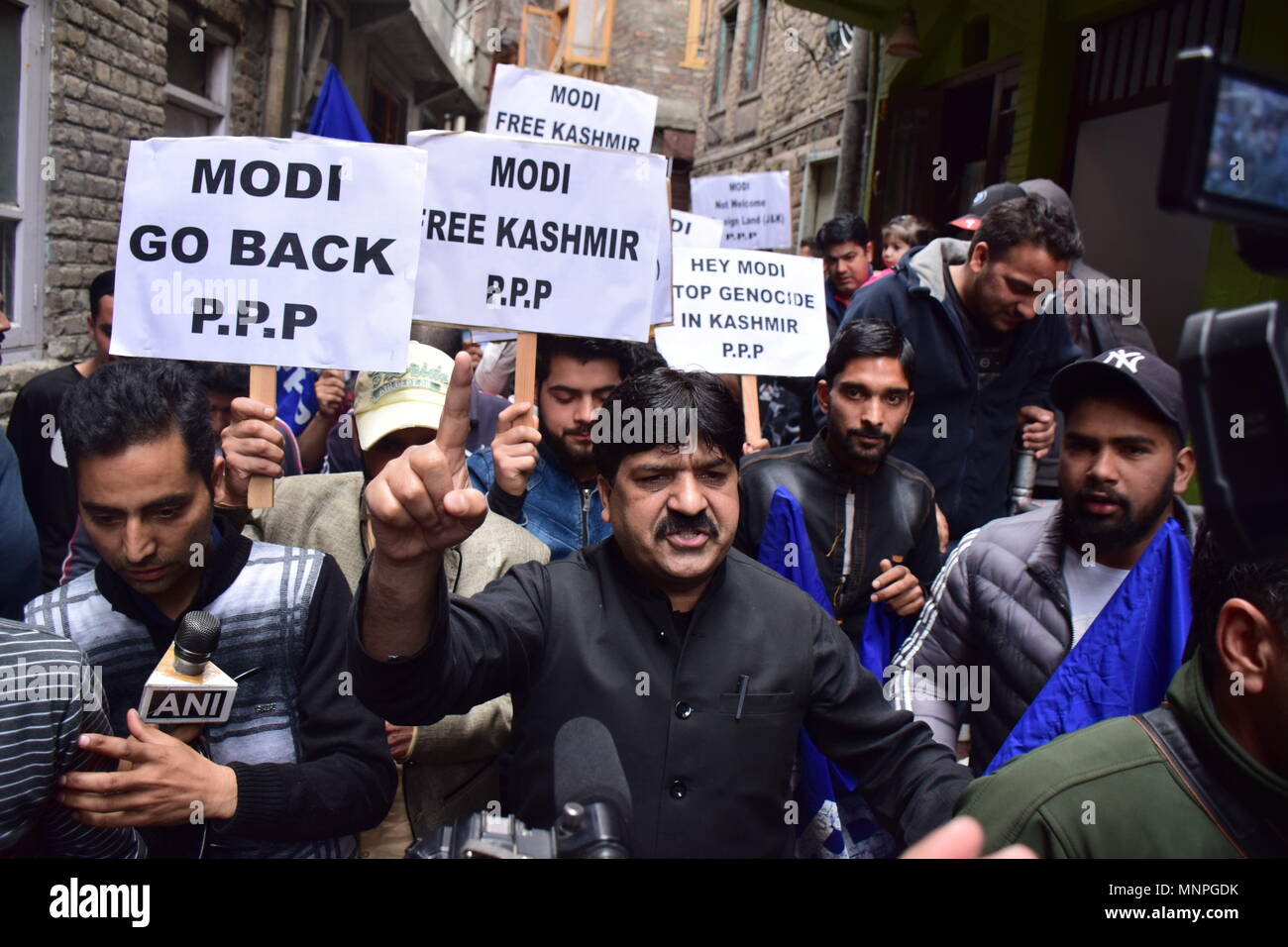 Kashmir, India, May 19, 2018.  People seen holding placards and shouts anti indian, anti Modi slogans during March towards city centre Lal chowk Srinagar.Despite of restrictions in many parts of Srinagar Summer Capital Of Indian Kashmir, people came on streets to march towards the lal chowk (city centre) as the JRL (Joint Resistance Leadership) called for Lal Chowk march to protest the visit of Prime Minister Narendra Modi to the state. Restrictions were imposed in many parts of Srinagar to prevent the protest march called by JRL. (Credit Image: © Abbas Idrees/SOPA Images Credit: ZUMA Press, I Stock Photo