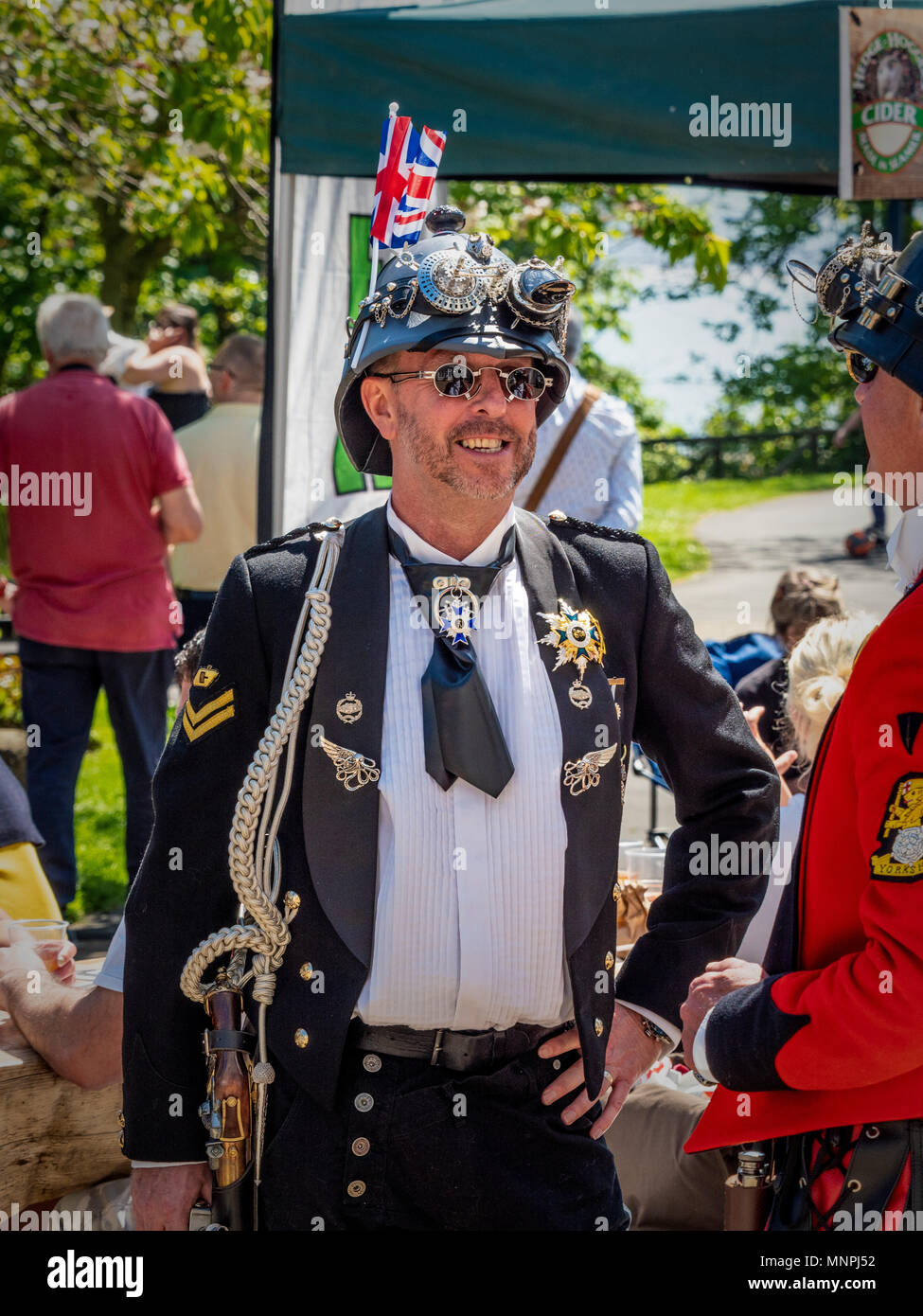 Filey, UK. 19th May, 2018. Many costumes incorporate Union Jack designs during the 2nd annual Filey Steampunk weekend as a nod towards the Royal Wedding. The steampunk fan weekend has returned for a second year and is attracting Steampunk fans from all over the UK. Photo Bailey-Cooper Photography/Alamy Live News Stock Photo