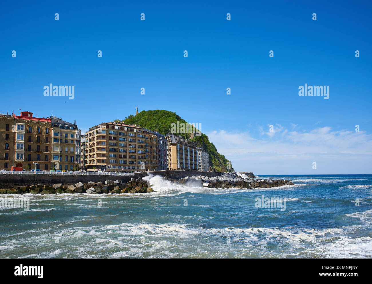 San Sebastian, Spain - May 10, 2018. Cantabrian sea at the mouth of the Urumea river with Monte Urgull in background at sunny day. San Sebastian. Basq Stock Photo