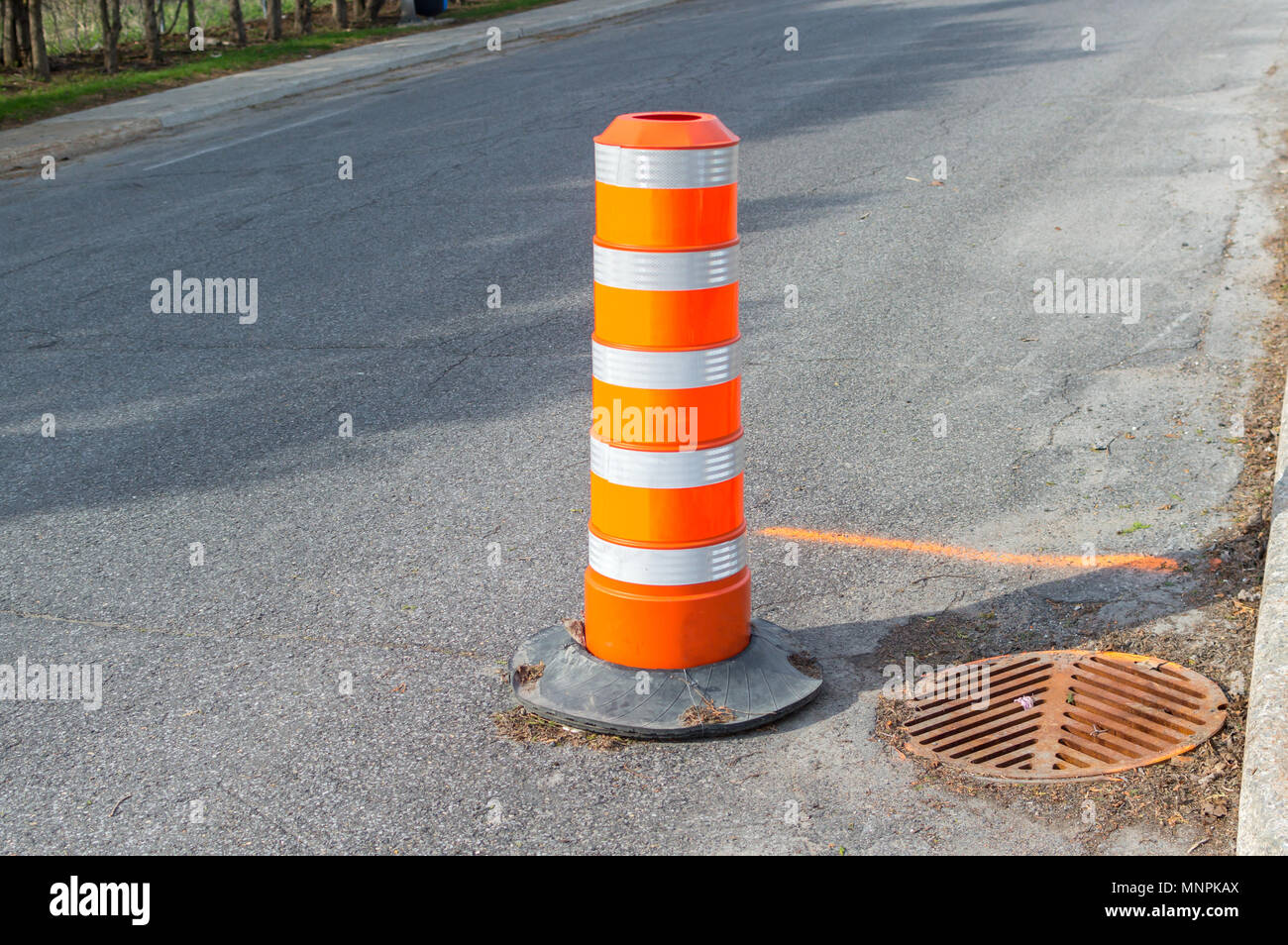 The orange traffic cone on the sidewalk in Montreal downtown, Canada