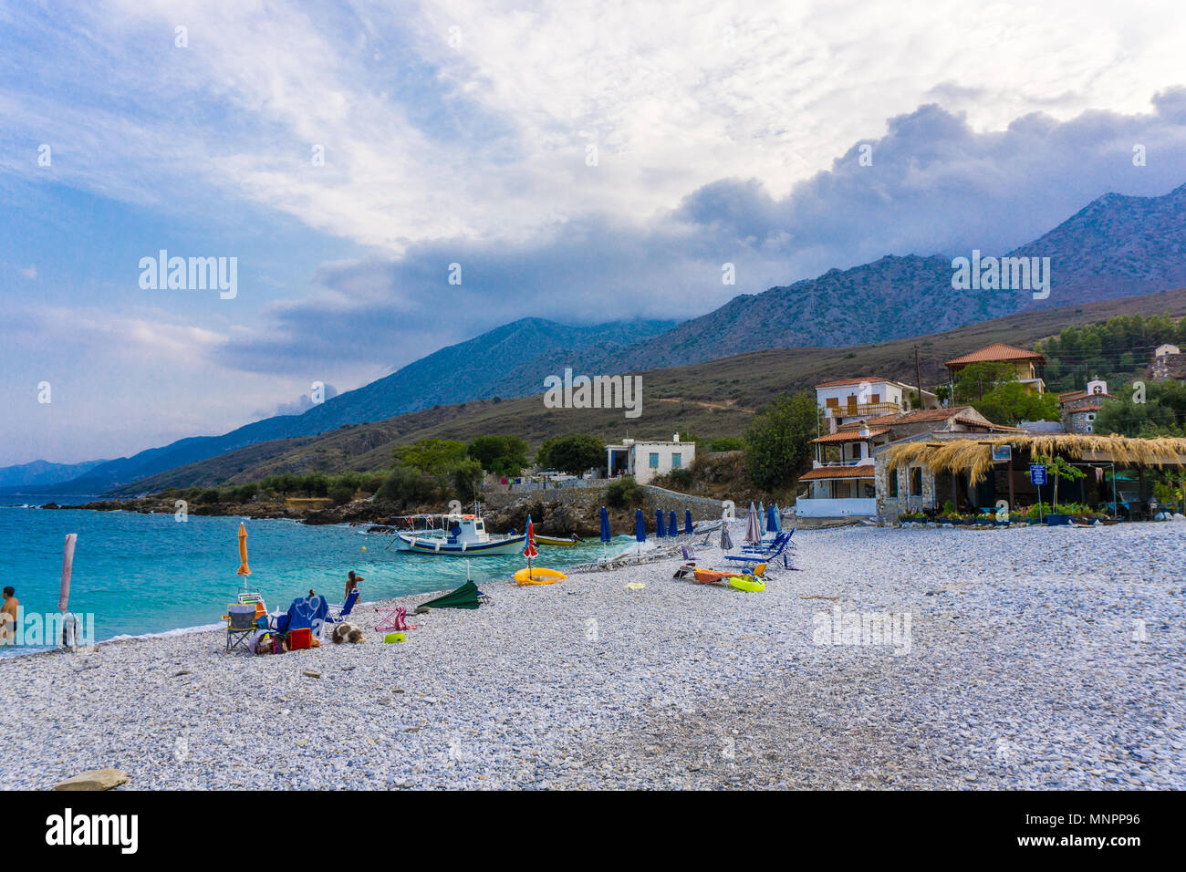 Beach in Kotronas village with blue crystal waters in eastern Mani region of Peloponnese, Greece Stock Photo