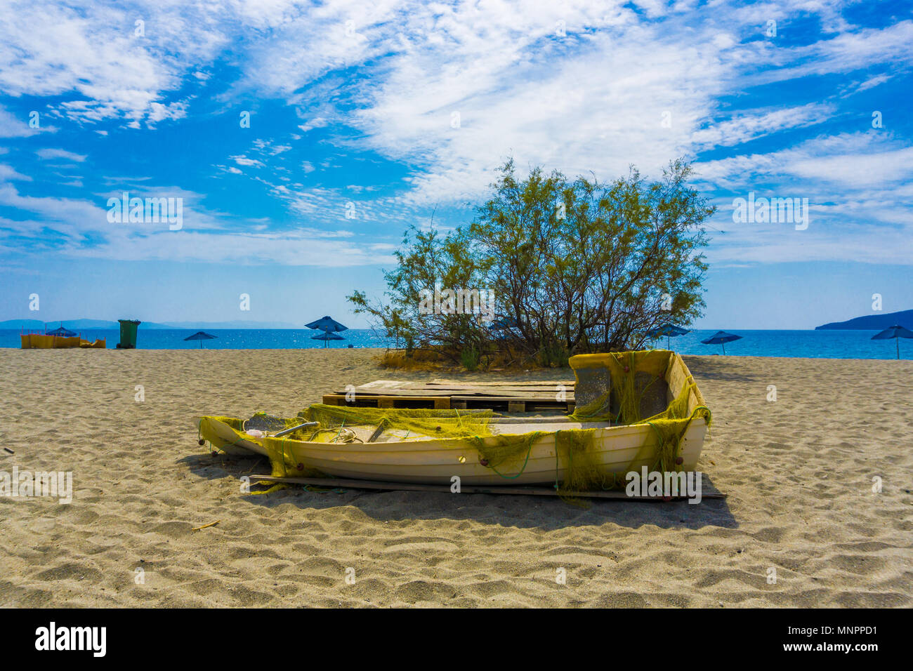 Camping at Vathi beach with blue crystal waters in eastern Mani region of  Peloponnese, Greece Stock Photo - Alamy
