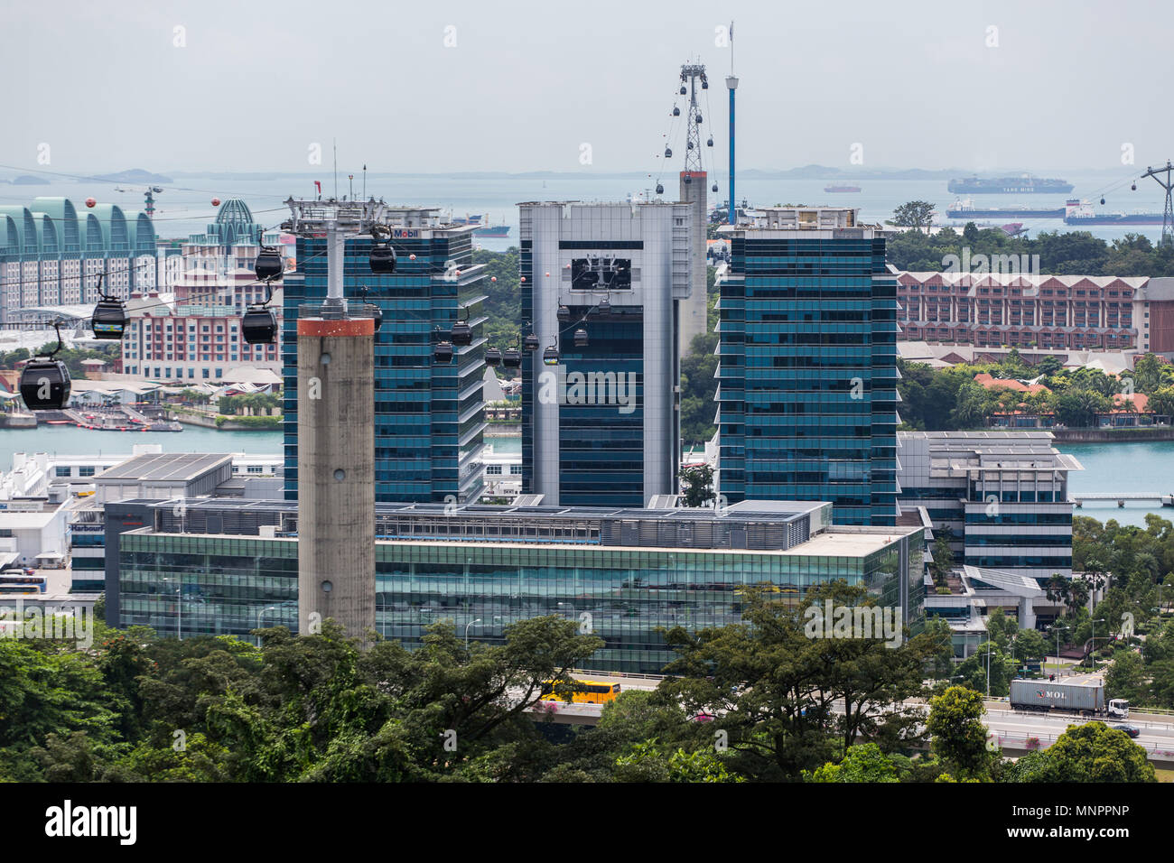 View of the cable cars for the visitors to cross over to Sentosa. Harbour Front Tower and Keppel Bay Tower in the foreground. Singapore. Stock Photo
