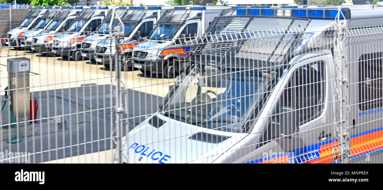 Secure fence around London Metropolitan Police storage depot & fuel facility for Mercedes Benz rapid response officer transport vans England UK Stock Photo
