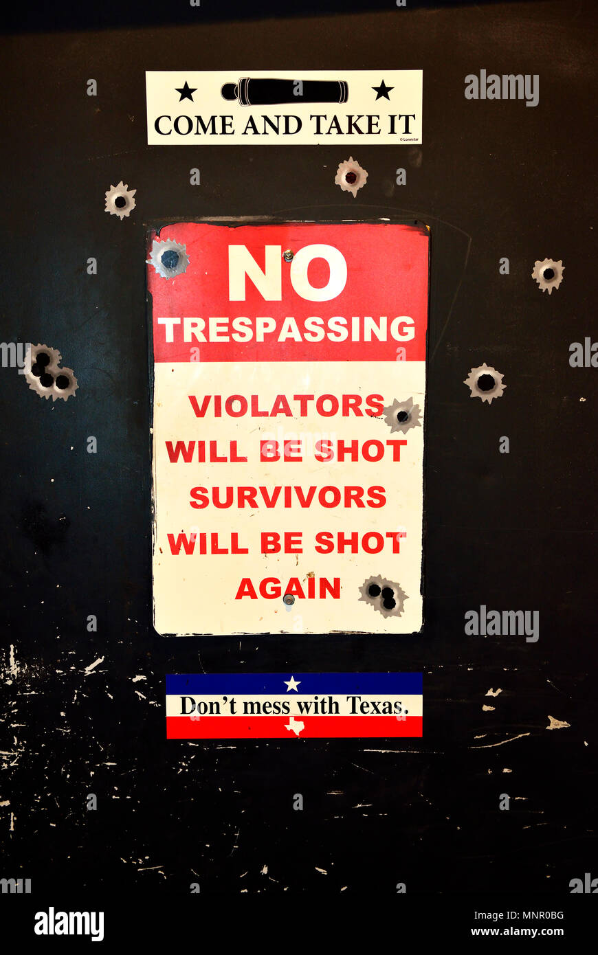 Toilet door with Texas slogans, Lockhart Smoke House, Bishop Arts District, Dallas, Texas, USA Stock Photo