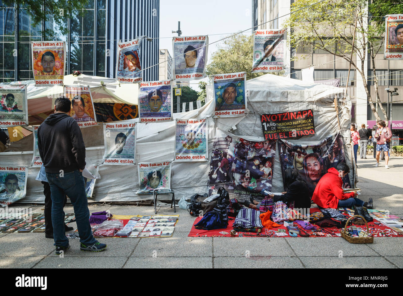 Iguala mass kiddnapping case activists camping site on Tase de la Reforma, shares the space with local street venders, Mexico City, Mexico. Stock Photo