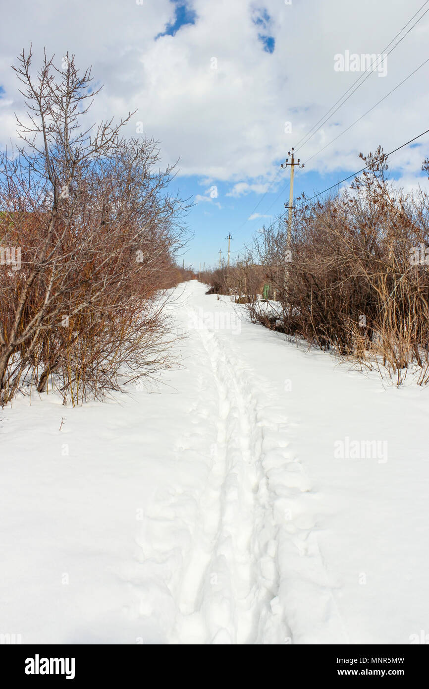The March footpath on snow suburban array Stock Photo - Alamy
