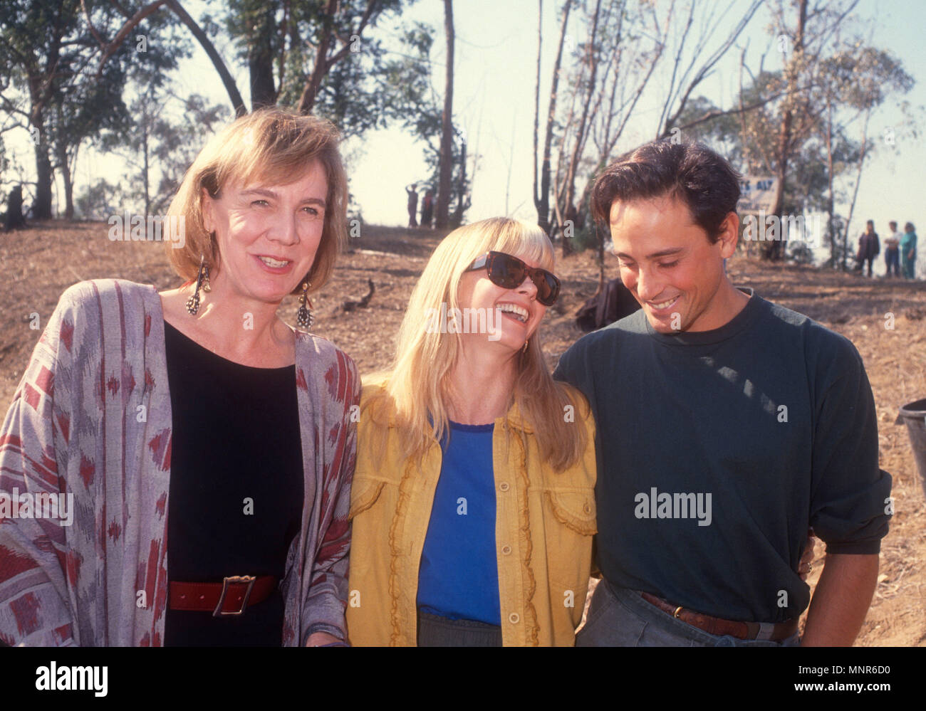 LOS ANGELES, CA - DECEMBER 1: (L-R) Actress Catherine E. Coulson, Singer Olivia Newton-John and actor Matt Lattanzi attend tree planting reforestation event on December 1, 1990 in Los Angeles, California. Photo by Barry King/Alamy Stock Photo Stock Photo