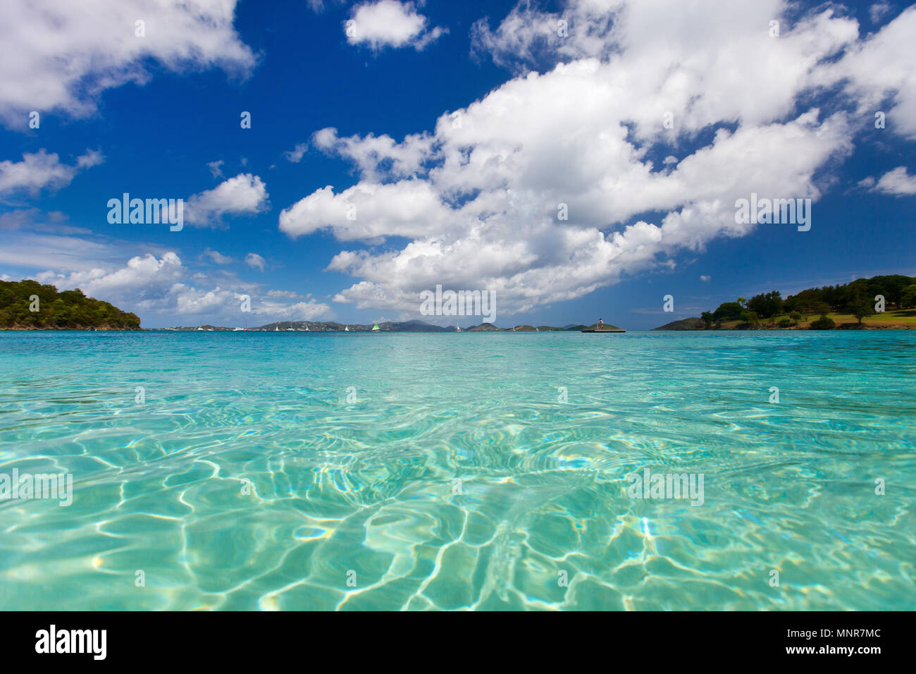 Beautiful tropical beach with white sand, turquoise ocean water and blue sky at St John, US Virgin Islands in Caribbean Stock Photo