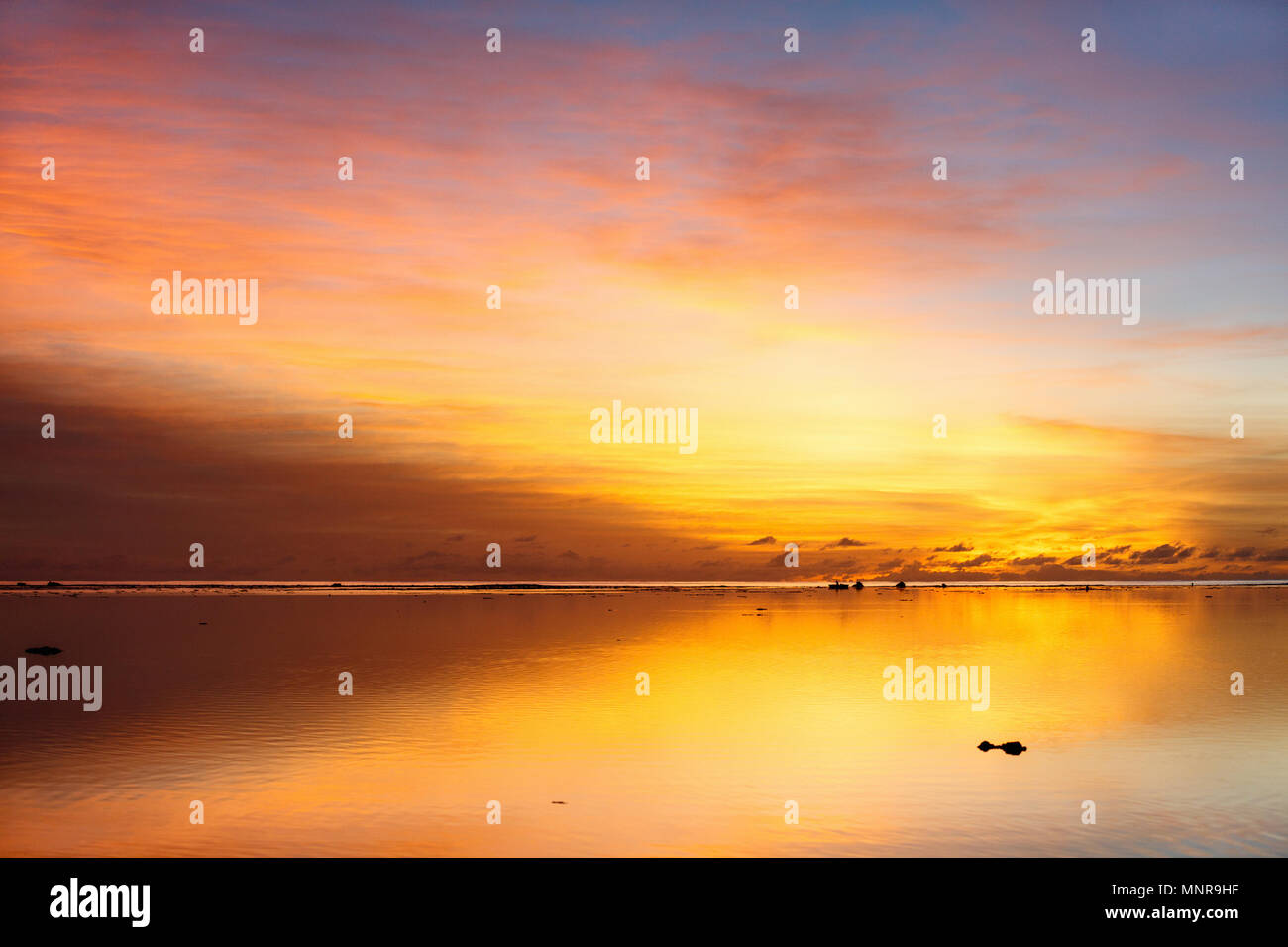 Beautiful sunset over tropical sea Stock Photo