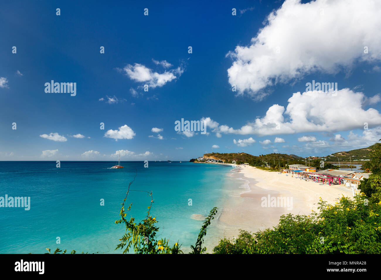 Idyllic tropical Darkwood beach at Antigua island in Caribbean with white sand, turquoise ocean water and blue sky Stock Photo