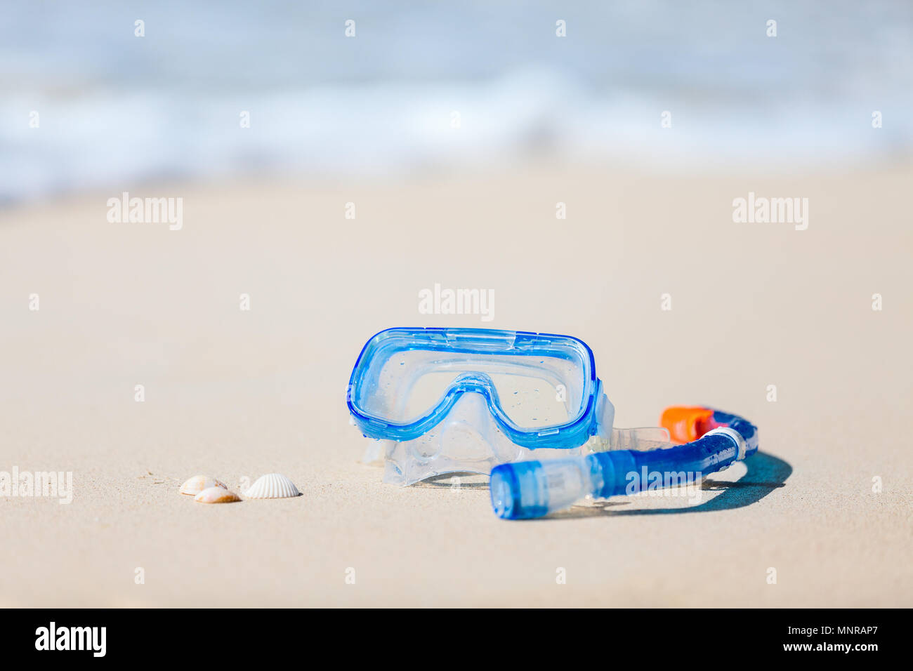 Snorkeling equipment mask and snorkel on tropical white sand beach Stock Photo