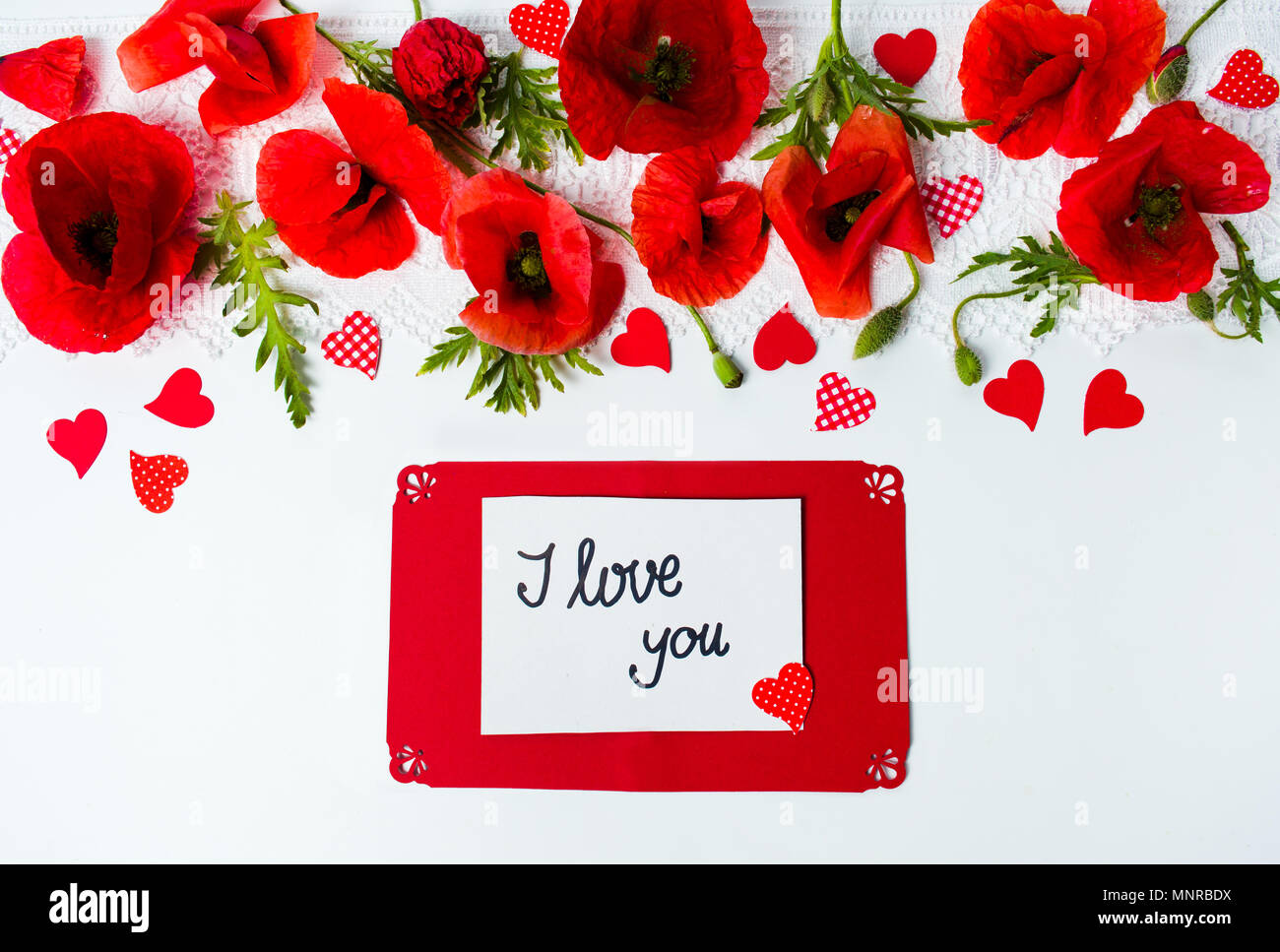 I love you card with poppy flowers on white background Stock Photo