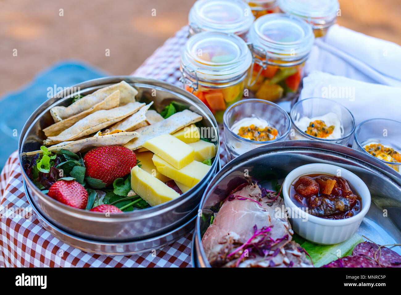 Luxury safari picnic bush breakfast with cheese and cold meat served and yogurt Stock Photo Alamy