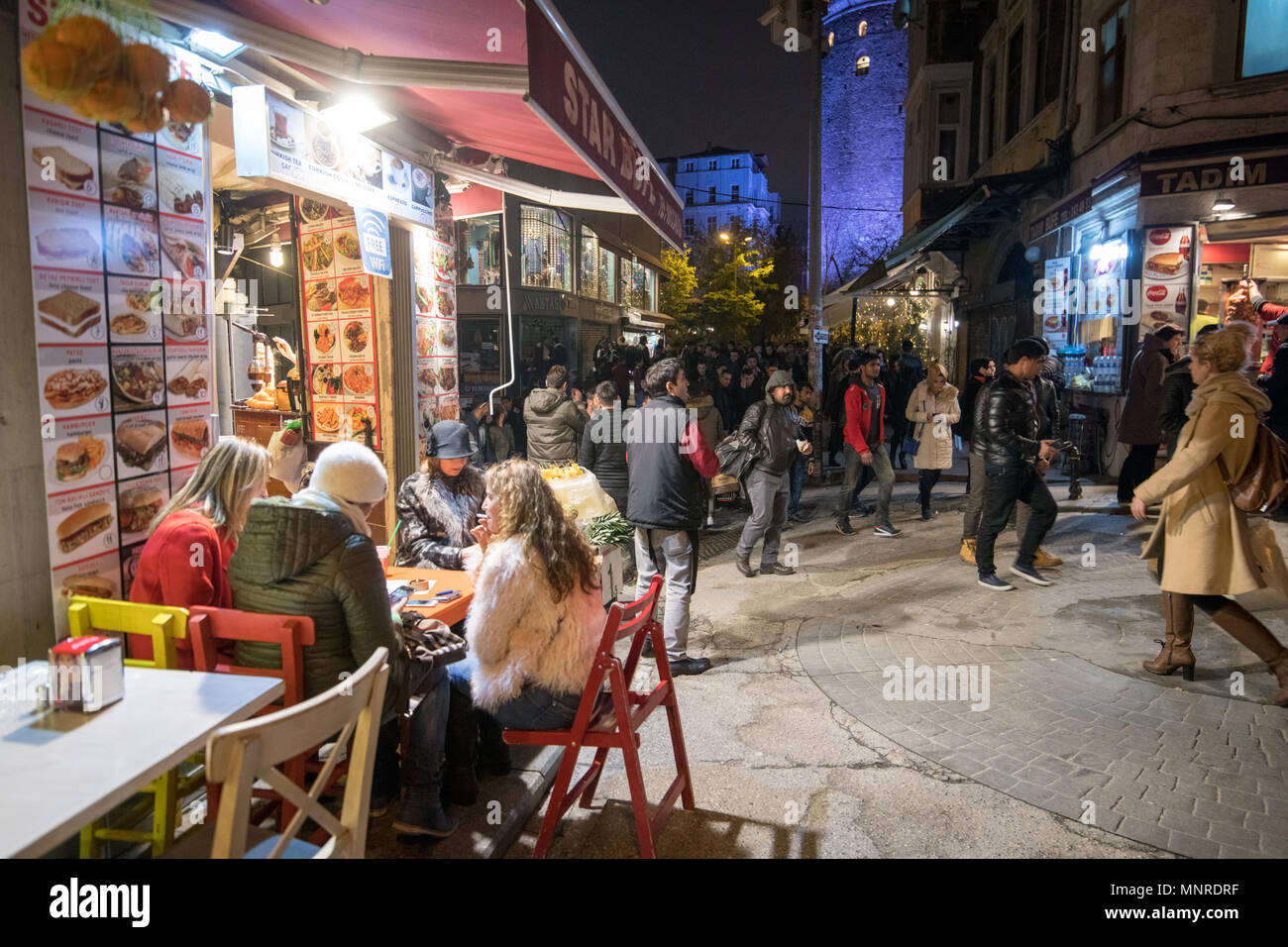 A Group Of People Gather Together At A Table Outside Of Resturant To Grab A Bite To Eat On The Busy Streets Of Istanbul Turkey Stock Photo Alamy A Group Of People Gather Together At A Table Outside Of Resturant To Grab A Bite To Eat On The Busy Streets Of Istanbul Turkey Stock Photo Alamy