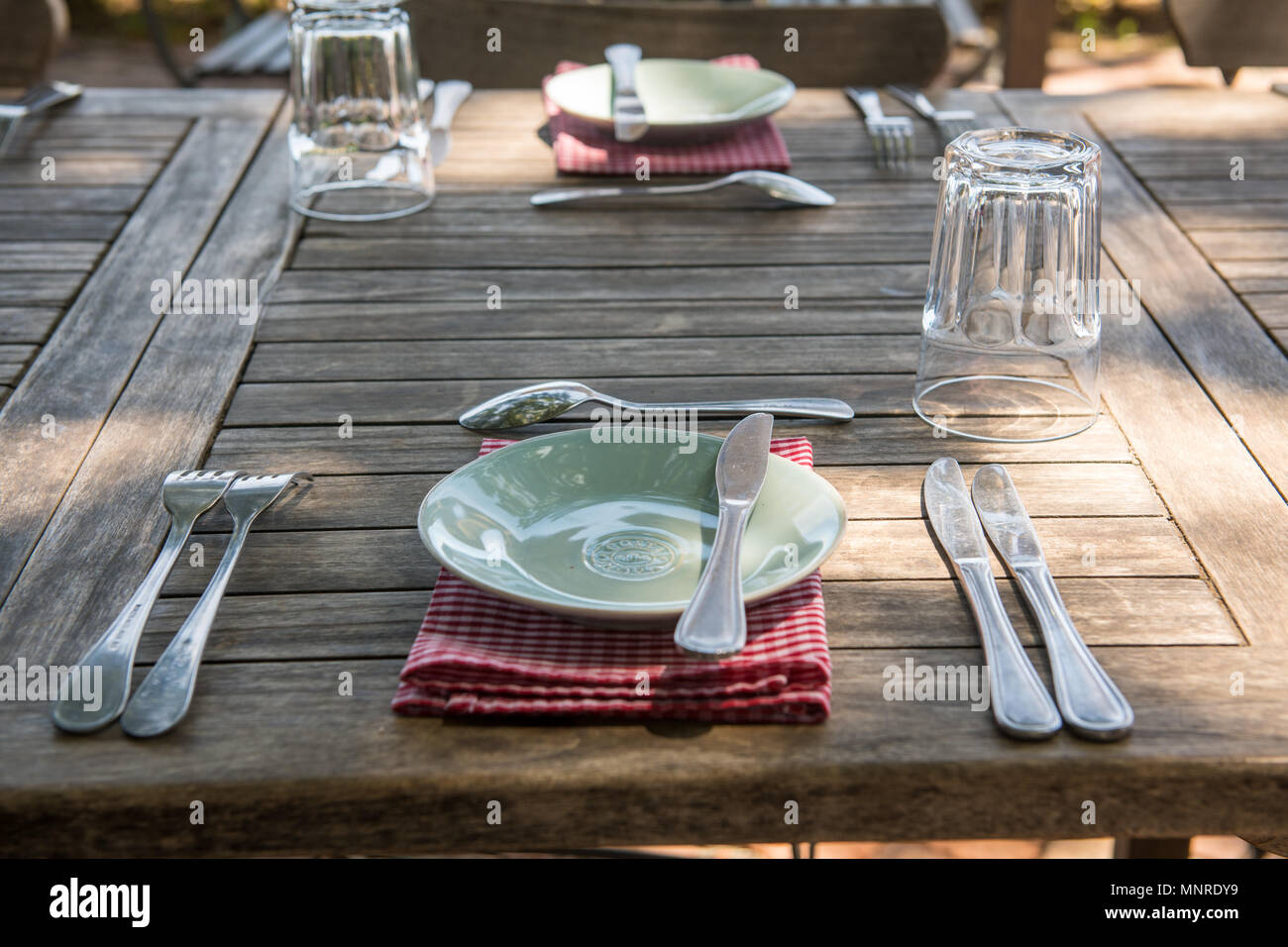 Dinner set arranged neatly on outdoor table at resturant, Cape Town, South Africa Stock Photo
