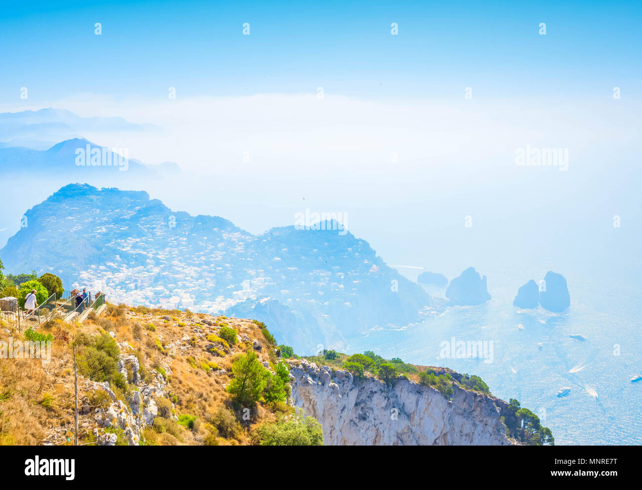 Capri landscape and Faraglioni cliffs and Tyrrhenian Sea blue water ...