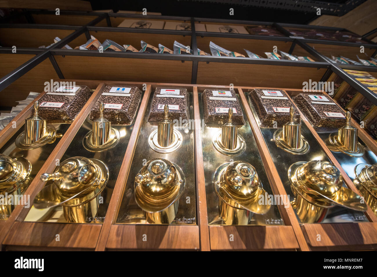 Low angle view of shiny coffee dispensers providing a variety of blends to shoppers, Istanbul, Turkey. Stock Photo