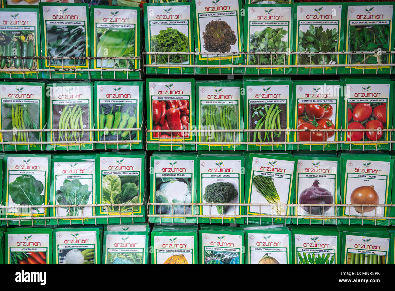 Metal shelves hold packages of seeds for sale at outdoor marketplace, Istanbul, Turkey. Stock Photo