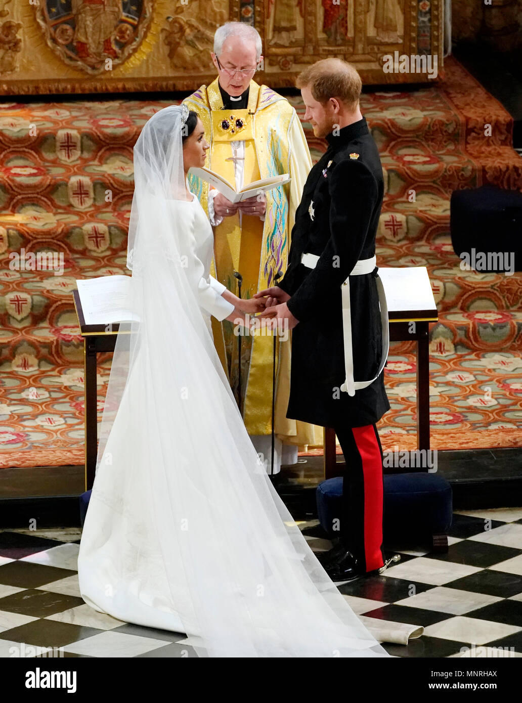 Prince Harry and Meghan Markle exchange vows in St George's Chapel at Windsor Castle during their wedding service, conducted by the Archbishop of Canterbury Justin Welby. Stock Photo
