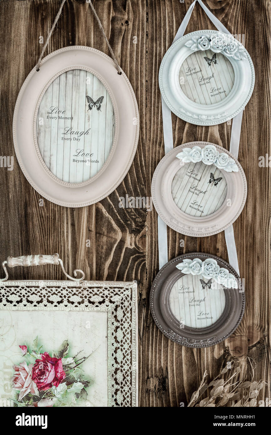 Picture frames with hanging ribbons on brown wooden background Stock Photo Alamy