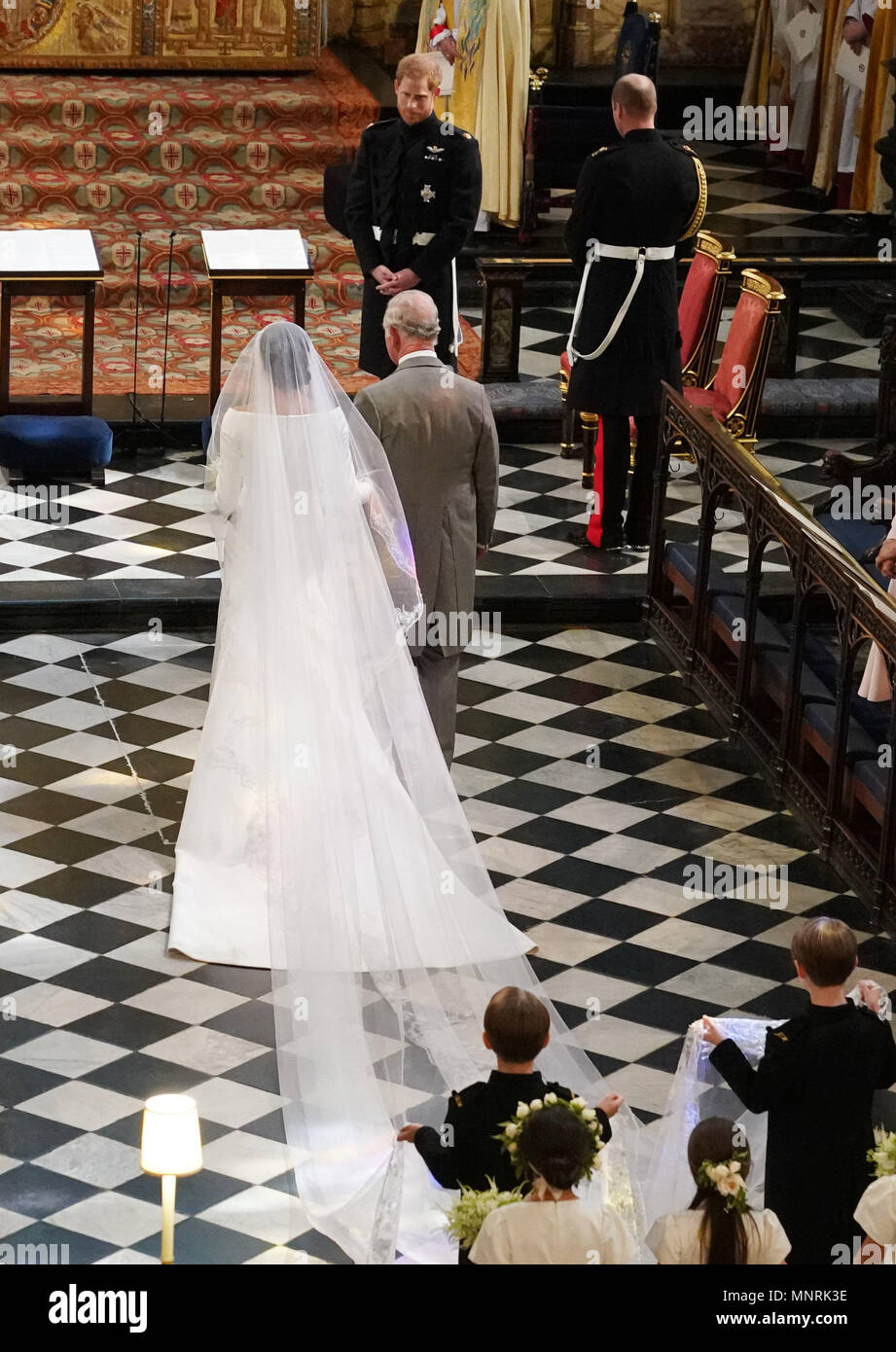 The Prince of Wales accompanies Meghan Markle to the altar in St George's  Chapel in Windsor Castle before she married his younger son, Prince Harry  Stock Photo - Alamy