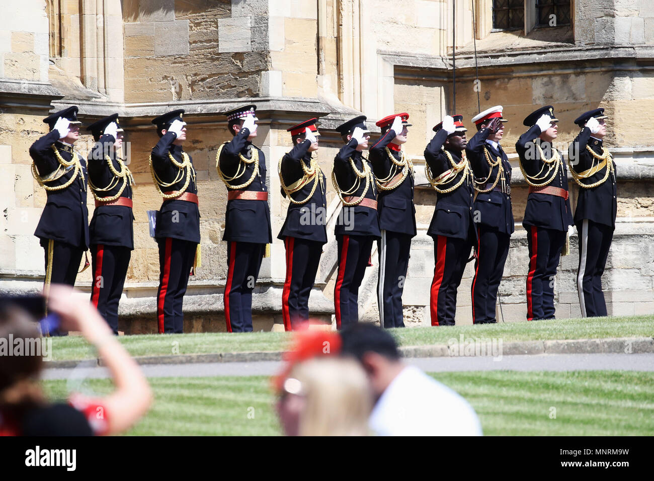Military personnel salute at the wedding of Prince Harry to Meghan