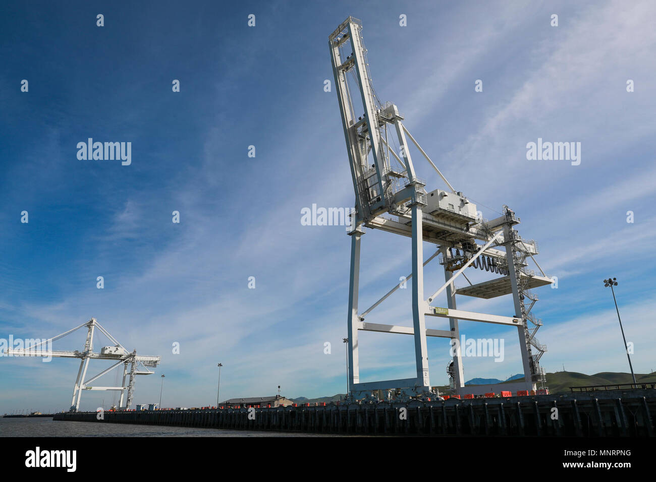 Gantry Cranes at Military Ocean Terminal Concord, California, Mar. 6, 2018. Trans Mariner 18 West is a real-world strategic mission utilizing U.S. Army Reserve and Active component Soldiers to conduct Port Operations allowing Army materiel and munitions containers for travel onward. Stock Photo