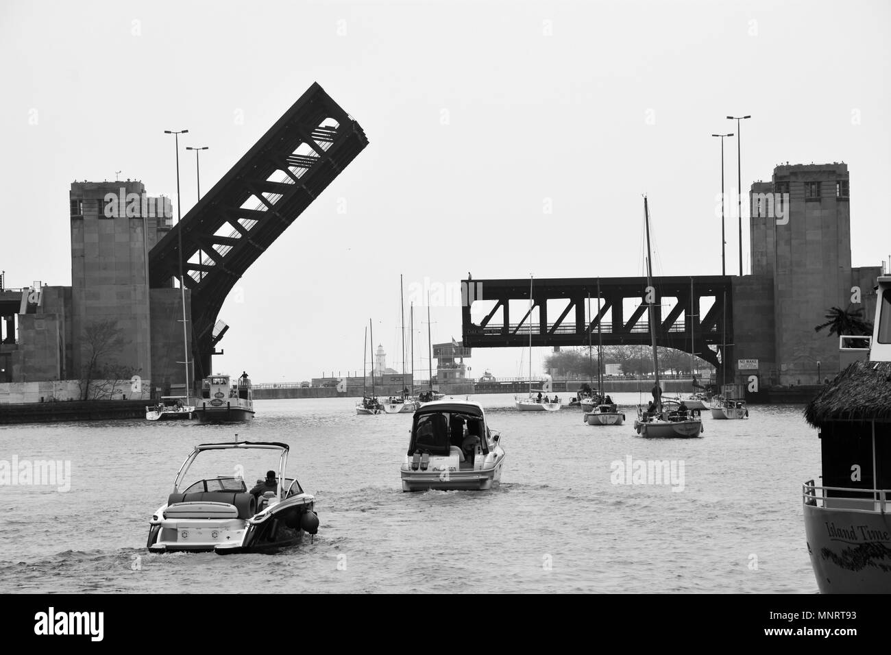The Lake Shore Drive bridge in Chicago is raised to let sailboats pass during the spring boat run to Lake Michigan. Stock Photo