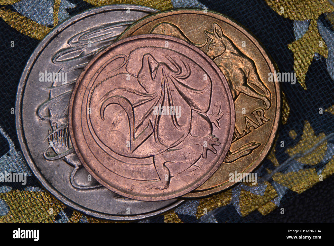 Finance pyramid - Australian coins stacked on each other. Two cent coin, discontinued in 1991 and withdrawn from circulation, on top. Stock Photo