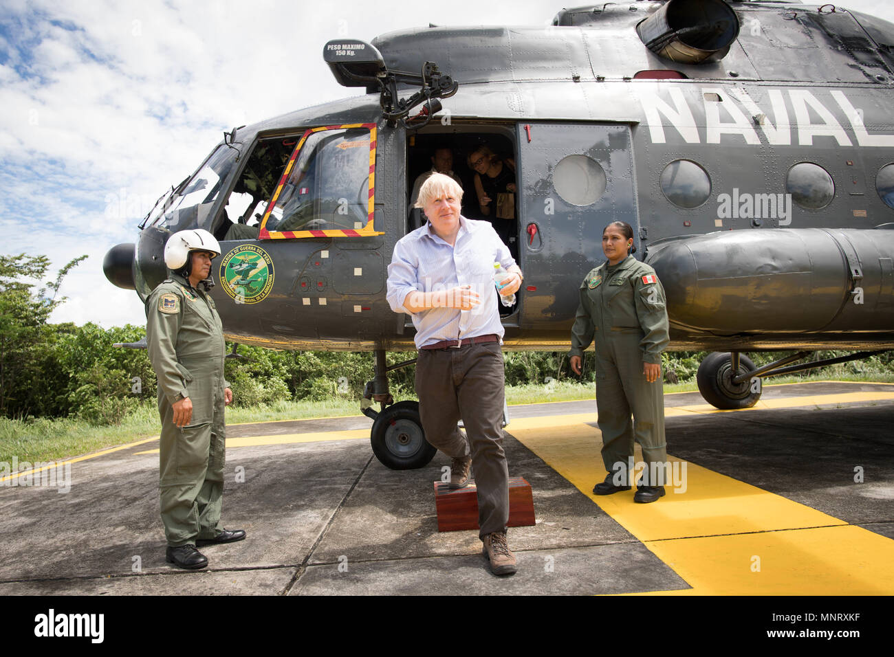 Foreign Secretary Boris Johnson disembarks a helicopter at the Nanay Naval Base on the Amazon river near Iquitos in Peru during a visit to meet members of the Peruvian armed forces who are trying to prevent the illegal wildlife trade. Stock Photo