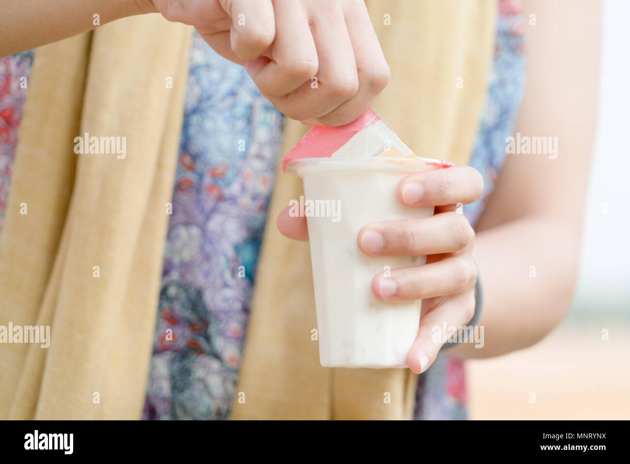 Women Hand Opening The Fruit Salad Soy Milk Jelly Yogurt Dessert 