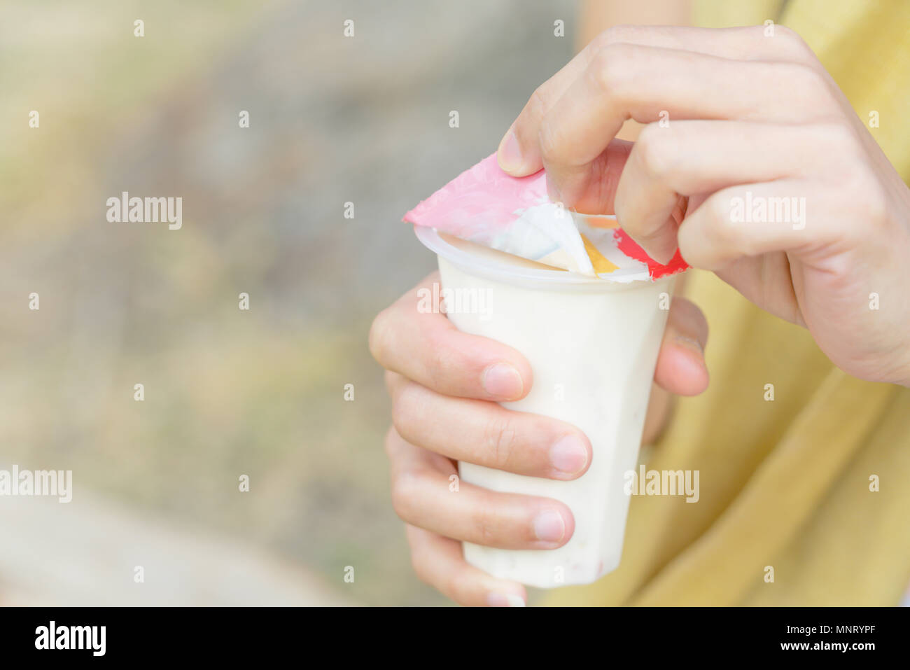 Women Hand Opening The Fruit Salad Soy Milk Jelly Yogurt Dessert 